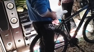 A guy massages my penis on the bike saddle until the sp
