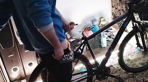 A guy massages my penis on the bike saddle until the sp