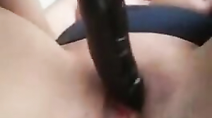 Monica inserts a dildo deep into her pussy