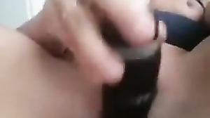 Monica inserts a dildo deep into her pussy